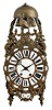 France, lantern clock, walnut case with ornate cast front incorporating the dial, side frets with rococo ornament, and top with fancy bell cage and two bells, surmounted by a rooster finial, Roman numeral white enamel cartouche dial with enamel center, blued steel hands, 8 day, time and strike movement with square plates