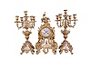 France, three piece mantel garniture, clock and matching candelabra on cast brass rococo bases with porcelain panels featuring polychrome figures and gilt borders, 8 day, time and strike, pendule de Paris movement by Japy Freres, counts the hours on gong.