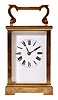 France, carriage clock, 8 day, time and strike, spring-driven movement with a lever escapement in an polished brass Anglaise case with five beveled glasses, white enamel dial, and blued steel hands, all in a leather carrying case.