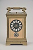 France, for the German market, hour repeating carriage clock with alarm, Anglaise variant case with beveled glasses, Roman numeral black enamel dial with integral white cartouches, gilt mask, and subsidiary alarm dial, gilt distaff hands, 8 day, time, strike, and alarm movement with lever platform and cut, bimetallic balance, sounding the hour and half hour in passing, and repeating the last hour on demand