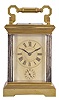 France, for George C. Shreve & Co., San Francisco, a gilt and silvered, hour repeating carriage clock, the architectural case with stepped, molded base and cornice, five beveled glasses, roman numeral gilt dial with Arabic alarm chapter, blued steel distaff hands, 8 day, three train movement with lever platform, striking the hour and half hour in passing, and repeating the last hour on demand