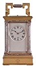 France, a gilt and silvered, Anglaise Riche cased hour repeating carriage clock, the architectural case with stepped, molded base and cornice, the corners with Corinthian columns, solid back with shutter for winding and setting apertures, and top with carrying handle, roman numeral silvered dial signed 