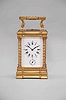 France, a good hour repeating, Anglaise Riche variant carriage clock with alarm, the gilt case with molded base and fluted band supporting twisted columns with Corinthian capitals, the entablature with fluted band, and stepped, molded cornice, case top with folding handle, roman numeral white enamel dial, blued steel distaff hands, three train movement with lever platform, sounding the hour and half hour in passing, and repeating the last hour on demand