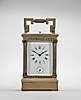 France, carriage clock, 8 day, time and strike with alarm and hour repeat, spring driven movement with lever platform escapement in an Anglaise case with stepped, molded base and cornice, the corners with Corinthian columns, and the top with carrying handle, Roman numeral white enamel dial, and blued steel distaff hands.