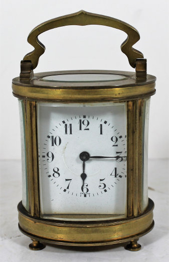 Antique Hour oval carriage Clock — Antique Clocks Price Guide