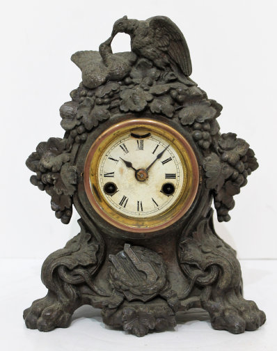 Antique Muller Dove iron case Clock — Antique Clocks Price Guide