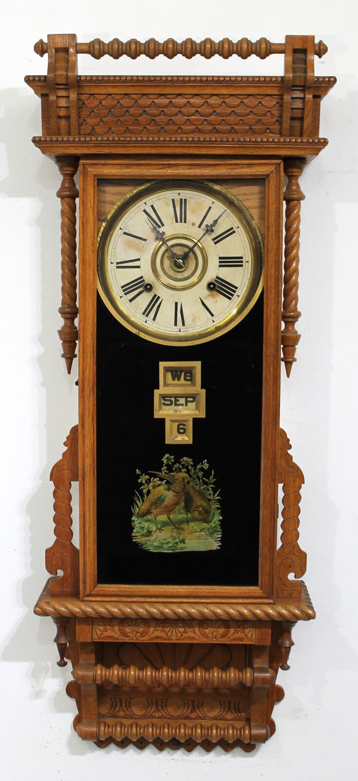 Wm. Gilbert Clock Co. “Sharon” calendar wall clock, ca. 1901. — Antique Clocks Price Guide