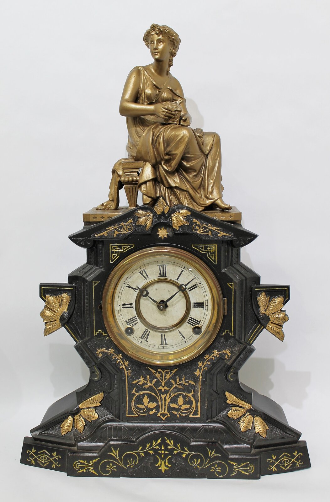 Waterbury Clock Co. iron case with figural, ca. 1890. — Antique Clocks Price Guide