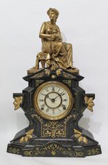 Waterbury Clock Co. iron case with figural, ca. 1890.