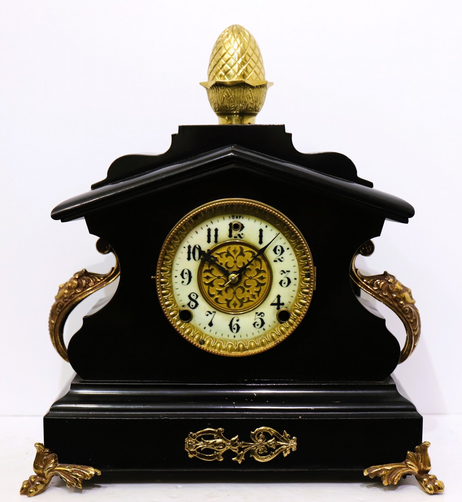 Enameled cast iron mantel clock, ca. 1900. — Antique Clocks Price Guide