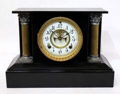 Ansonia Clock Co. enameled iron black mantel, ca. 1900.