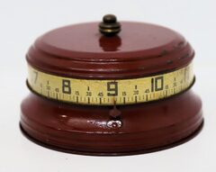 Rotary tape measure clock, ca. 1940.