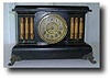 Gilbert Black Wood Clock with columns, circa 1900