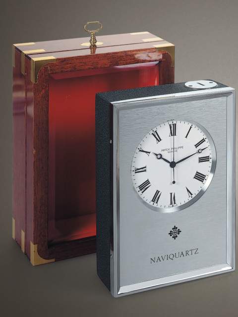 "Naviquartz", mahogany electronic chronometer with center-seconds with original certificate and manual. Patek Philippe & Cie., circa 1973. — Antique Clocks Price Guide