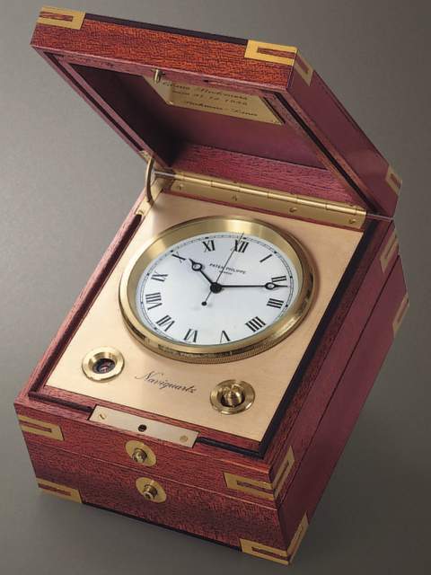 "Naviquartz III", mahogany electronic chronometer with center-seconds with original box, certificate and instruction manual. Patek Philippe & Cie., circa 1985. — Antique Clocks Price Guide