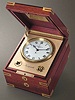 "Naviquartz III", mahogany electronic chronometer with center-seconds with original box, certificate and instruction manual. Patek Philippe & Cie., circa 1985.