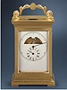 Gilt brass, 1 year-going double-barrel carriage clock with 30-second remontoir, chronometer escapement and regulator dial, accompanied by a chased ivory paneled key with Chinese motifs. Aulet a Paris, circa 1830.