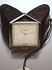 Montre de sac, stainless steel and black leather purse watch, which, when opened, becomes a little bedside clock. Rolex, 1940's.
