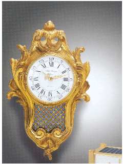 Gilt bronze solar-powered electric clock designed as a small Louis XV wall cartel. Patek Philippe & Cie. c. 1960's — Antique Clocks Price Guide