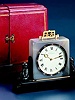 18K gold, agate, labradorite, and bakelite eight-day going desk clock, Cartier, Paris, circa 1920.