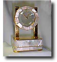 Swiss silver gilt and mother-of-pearl mystery clock. — Antique Clocks Price Guide