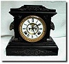 Ansonia black Enameled case mantel clock with visible escapement