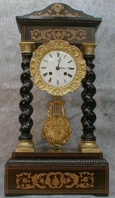 FRENCH EMPIRE CLOCK IN A WALNUT AND EBONY CASE, CIRCA 1840. — Antique Clocks Price Guide