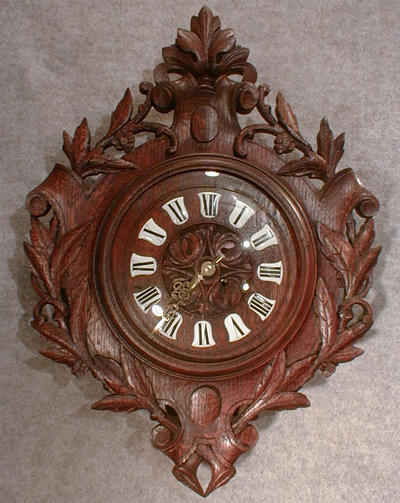 FRENCH CARTEL STYLE WALL CLOCK IN A CARVED OAK CASE, MOTIF IS A CREST WITH OAK LEAVES. CIRCA 1880-1890. — Antique Clocks Price Guide