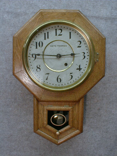 SETH THOMAS OAK 10" SHORT DROP SCHOOL CLOCK. CIRCA 1920'S. — Antique Clocks Price Guide