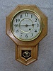 SETH THOMAS OAK 10" SHORT DROP SCHOOL CLOCK. CIRCA 1920'S.