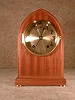 Seth Thomas "Essex" mahogany cabinet clock with satinwood banding, circa 1905-1910.