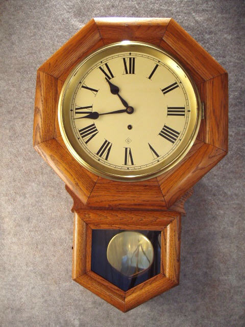 This Is An "Admiral" Short Drop Oak School Timepiece By The Gilbert Clock Co. — Antique Clocks Price Guide