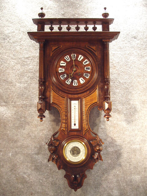 French Weather Station Clock, With A Thermometer And Barometer In A Walnut Case With Carved Pods Beside The Barometer, Single Side Columns And A Widows Walk Crown. Circa 1895-1900 — Antique Clocks Price Guide