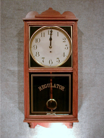 This Is An American Oak Store Type Wall Clock, Called The "Pelican" By The Waterbury Clock Co. Circa 1910-1920 — Antique Clocks Price Guide
