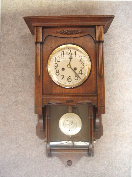 German "Berliner" Style Wall Clock With An Enclosed Bottom Case Of Oak Solids And Veneers By F.  Mauthe. Circa 1900-1910. — Antique Clocks Price Guide