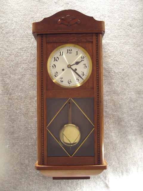 German Box Clock In An Oak Case With An Applied Carving On The Crown And Beading Down The Sides Of The Door. Circa 1910. — Antique Clocks Price Guide