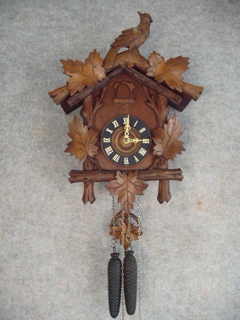 30 Hour Weight Driven German Cuckoo Clock In A Carved Grape Leaf And Grape Motif With A Diving Bird On The Center Of The Crown. Circa 1900-1910. — Antique Clocks Price Guide
