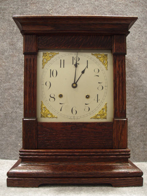 "Cabinet No. 27" Mantel Clock By The Ansonia Clock Co, In An Old Oak Case. Circa 1910-1915. — Antique Clocks Price Guide