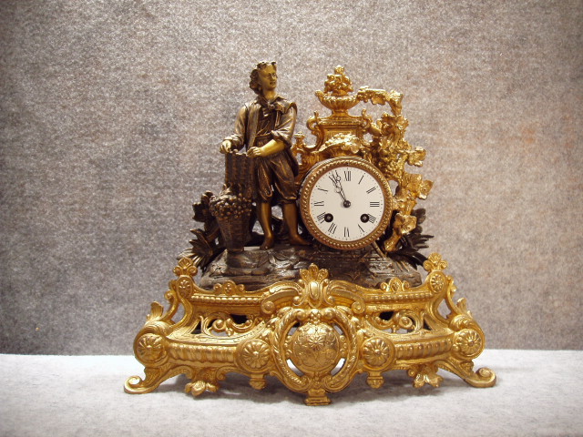 French Spelter Case Mantel Clock With A Man And Grapes Motif. Circa 1885. — Antique Clocks Price Guide