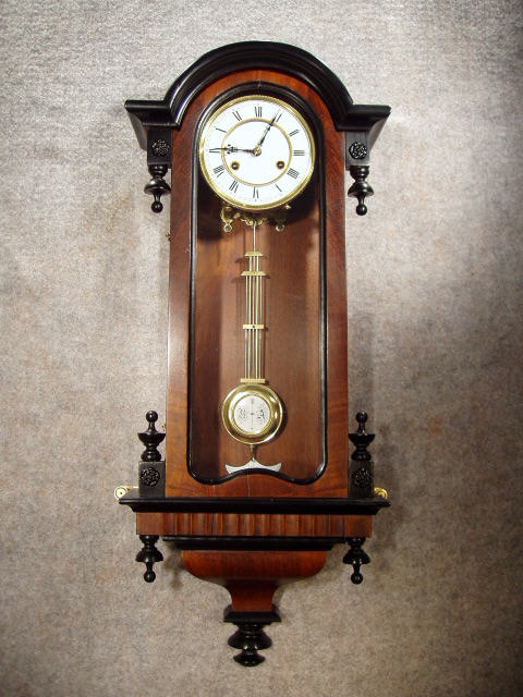 German Arched Top Black And Tan Cased R-A Style Wall Clock By Junghans. Circa 1890'S. — Antique Clocks Price Guide