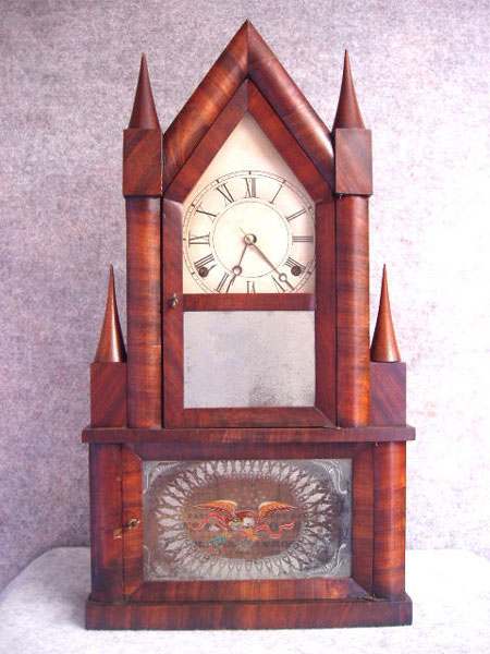 Steeple On Steeple Shelf Clock In A Mahogany Veneered Case By Elisha Manross In Bristol, Ct, And Has A Strap Brass Eight Day Movement That Strikes The Hours On A Gong. Circa 1850'S. — Antique Clocks Price Guide