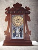 This Is The "Joslyn" (From The "J" Assortment) Walnut Shelf Clock By The Ansonia Clock. Circa 1900-1910. 