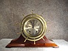 Brass Cased Spoked Bezel Ship's Clock By The Seth Thomas Clock Co On A Mahogany Stand. Circa Pre 1937.