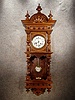 German "Berliner" Style Open Well Wall Clock, Made Of Walnut Solids And Veneers. Circa 1900.