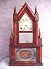 Steeple On Steeple Shelf Clock In A Mahogany Veneered Case By Elisha Manross In Bristol, Ct, And Has A Strap Brass Eight Day Movement That Strikes The Hours On A Gong. Circa 1850'S.