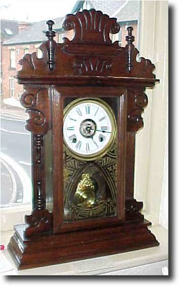 Walnut Cased Gingerbread Clock, circa 1900 — Antique Clocks Price Guide