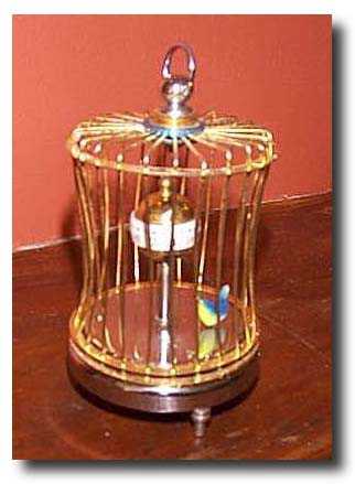 Japanese Animated Singing Bird Birdcage Clock — Antique Clocks Price Guide