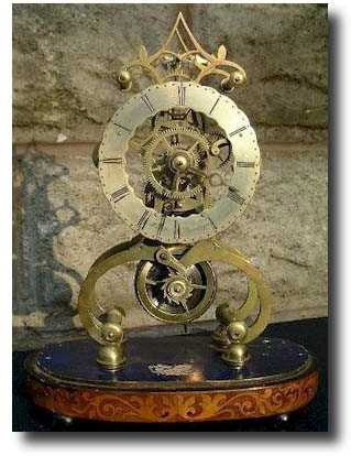 A small Regency skeleton timepiece, circa 1830, by James Edwards of Stourbridge. — Antique Clocks Price Guide