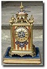A French mantel clock decorated with champleve enamel.