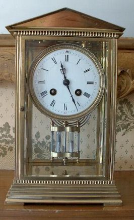 A French Clock circa 1912 in a gilt-brass four-glass case of architectural form. — Antique Clocks Price Guide